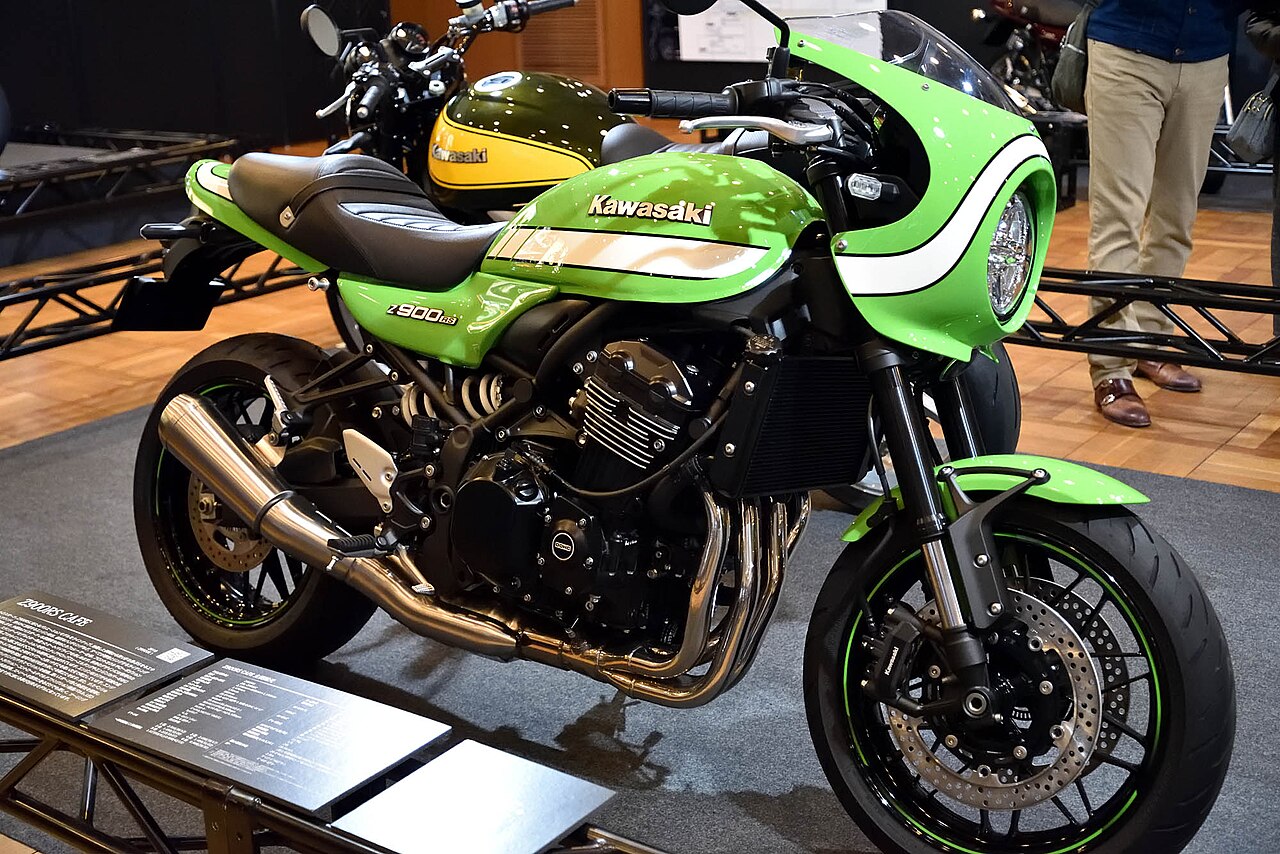 Green and white 2018 Kawasaki Z900RS Cafe with a front cowl, displayed at Kawasaki Good Times World
