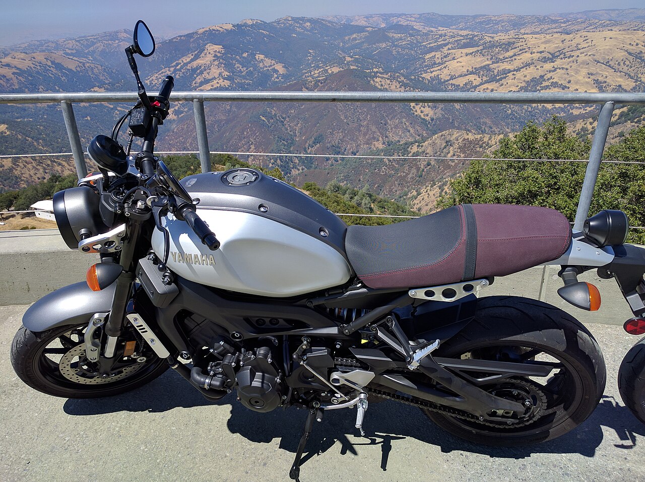 Silver and black 2016 Yamaha XSR900 parked outdoors, viewed from the left side